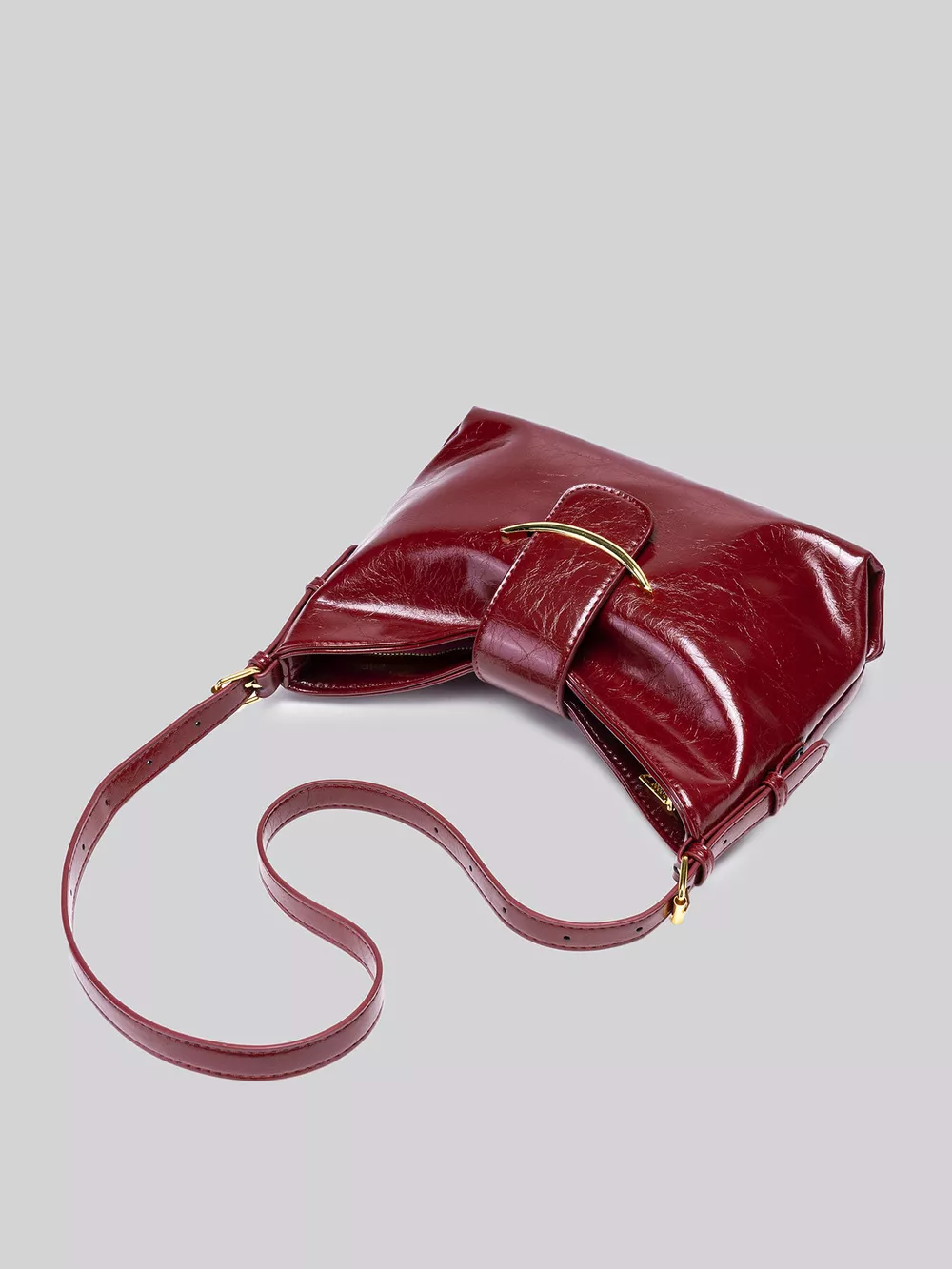 Elegant Glossy Patent Leather Shoulder Bag with Crescent Gold Accent, image 8