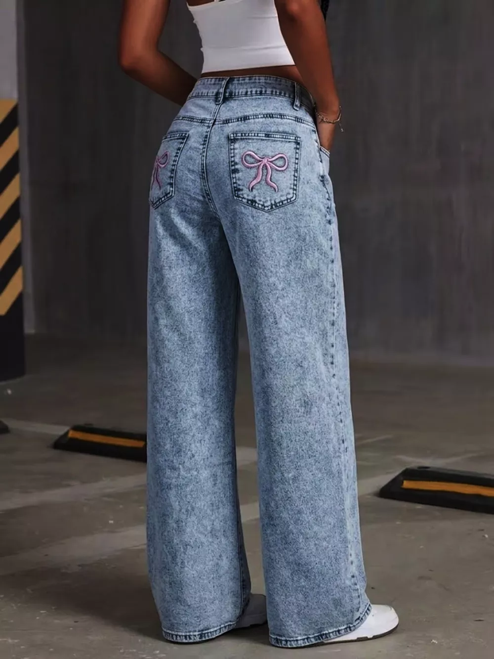 Washed Wide Leg Jeans with Embroidered Bow Detail